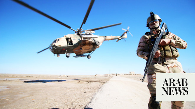 A helicopter provides aerial support, during a ground Iraqi military ...