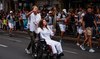 Lebanese photojournalist, wounded in Israeli strike, carries Olympic torch to honor journalists