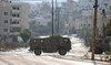 Palestinian officials say Israel troops kill 5 in West Bank raid