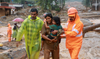 Rescuers scramble to find survivors after dozens killed in Kerala landslides