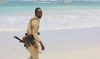 A Somali policeman patrols near the area of an attack in Mogadishu on August 3, 2024. (AFP)