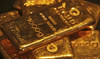 Gold slides over 2% as wider market rout spills over
