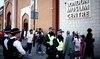 Police officers stand guard outside the East London Mosque after Friday prayers in Tower Hamlets in London on August 9, 2024.