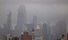 Midtown Manhattan sits under a layer of heavy clouds on August 09, 2024, in New York City. (AFP)