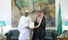 Guinea’s Minister of Planning and International Cooperation Ismael Nabe hands over the letter to Saudi deputy foreign minister.