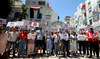 Tunisian journalists carry placards and shout slogans during a demonstration in Tunis on May 27, 2024. (AFP)