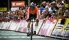 Defending women’s Tour de France champion Demi Vollering wins time trial and takes overall lead