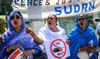 Women shout slogans as they take part in a demonstration on the opening day of Sudan ceasefire talks in Geneva, on August 14.