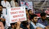 Doctors hold posters as they strike to protest the rape and murder of a young medic from Kolkata, at the Gandhi Hospital.