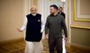 Ukraine’s President Volodymyr Zelensky speakS with Indian Prime Minister Narendra Modi at the Mariinskyi Palace.