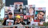 Relatives of Israeli hostage Edan Alexander speak during a demonstration near Kibbutz Nirim in southern Israel.