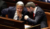 Israeli right wing Knesset members Itamar ben Gvir (L) and Bezalel Smotrich (R) chat at the Knesset in Jerusalem. (File/AFP)