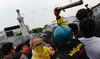 Thai anti-government protesters scuffle with a police during a protest in Bangkok on Saturday. (AFP)