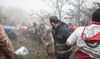 Rescue team works following a crash of a helicopter carrying Iran's President Ebrahim Raisi, in Varzaqan.