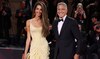 Amal and George Clooney walk the red carpet at ‘Wolfs’ premiere in Venice