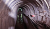 An Israeli soldier is seen inside a tunnel that the army claimed is a “Hamas command tunnel” in Gaza City. (File/AFP)