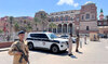 Libyan Ministry of Interior personnel stand guard in front of the Central Bank of Libya in Tripoli, Libya, August 27, 2024. 