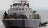 Migrants aboard a Cyprus marine police patrol boat are brought to a harbor after being rescued from their own vessel.