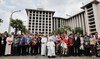 Pope Francis and Grand Imam of Istiqlal Mosque Nasaruddin Umar pose for a photo following an inter-religious gathering.