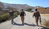 Kurdish peshmerga fighters walk in Sulaimaniyah on September 28, 2022. (AFP)