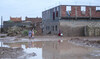 Women walk past floods caused by heavy rainfall in Tagounite, Zagora, southern Morocco, Saturday, Sept. 7, 2024. (AP)