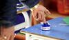 A man dips his finger in ink after casting his ballot at a polling station in Tunis, Saturday, Dec. 17, 2022. (AP)