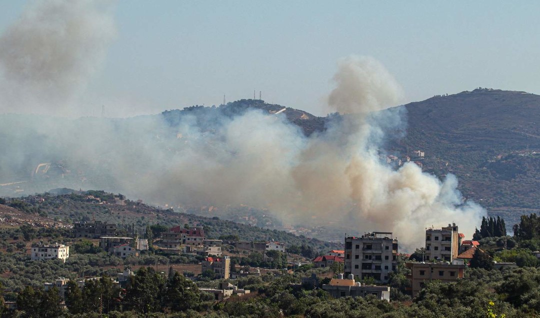 Smoke billows from a site targeted by the Israeli military in the southern Lebanese border village of Kafr Kila on July 29, 2024