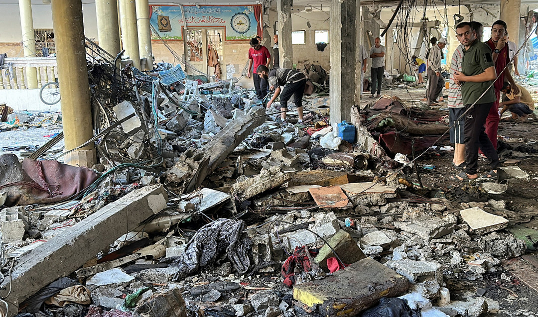 Israeli strike kills nearly 100 in Gaza school refuge, civil defense officials say