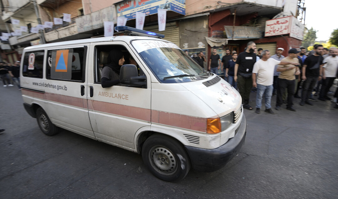 An ambulance believed to be carrying wounded people, after multiple explosions were heard in Beirut on Wednesday.