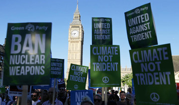 May defends UK nuclear arms as parliament votes on renewal