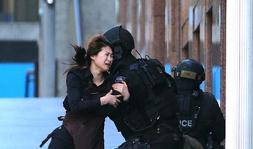 Two killed as Australian police storm siege cafe