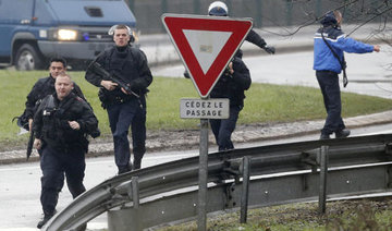 Twin hostage drama as Paris massacre suspects cornered