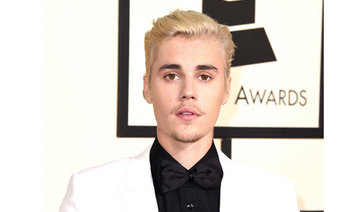 Justin Bieber settles 
paparazzi assault suit