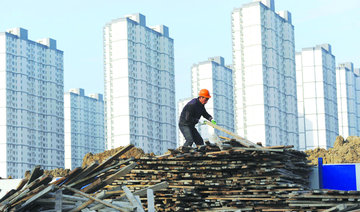 China cuts growth goal, puts focus on reform