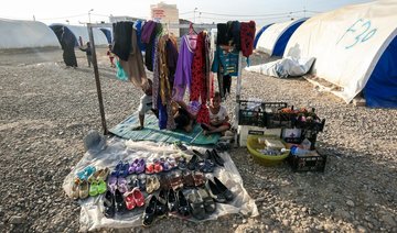 Near Mosul, soldiers and displaced meet at the spa