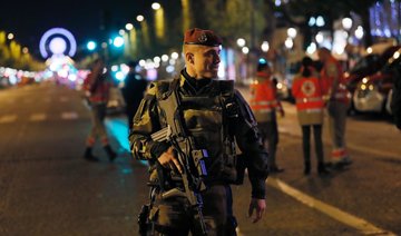 Tourists venture back to Champs Elysees after attack