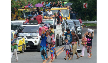 Thousands flee homes as Philippine troops battle militants in Marawi