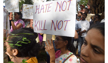 Indian women don cow masks to show they are less safe than cattle