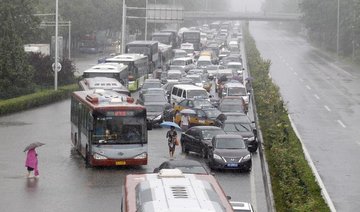 Storms disrupt Beijing flights, authorities warn of flash flooding, landslides