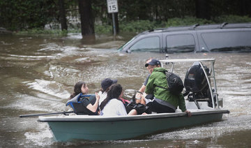 Catastrophic floods strike Houston; thousands flee homes