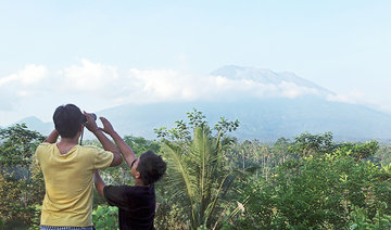 Thousands evacuated as volcano rumbles on Indonesian holiday spot Bali