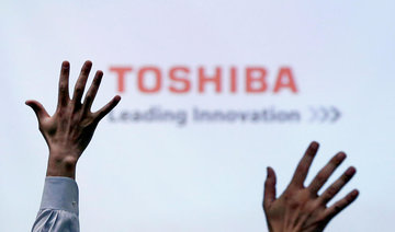 Toshiba signs deal to sell chip unit to Bain-led group for $18 billion