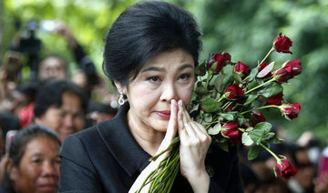 Thailand revokes passports of exiled former PM Yingluck