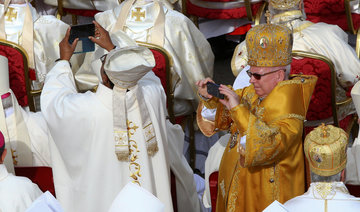 Lift up your hearts, not your cell phones, pope tells priests, bishops