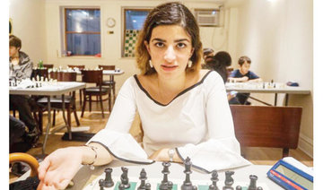 Dumped Iranian chess star fights back into the game