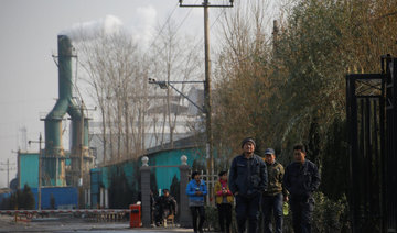 Beijing spared as smog triggers curbs on factories across northern China