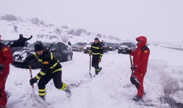 Spanish army called in as snow traps thousands on roads