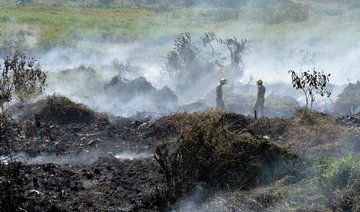 Indian army soldiers fight fire from highly polluted lake