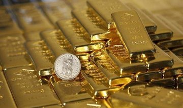 Gold inches back toward 17-month peak as dollar moves lower
