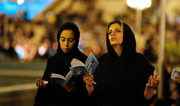 Hijabs held aloft as Iranian women protest compulsory cover-up